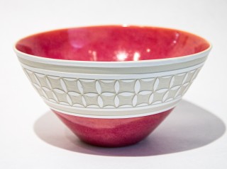 This pretty ceramic bowl in a glossy, rosy pink was created by Loren Kaplan.