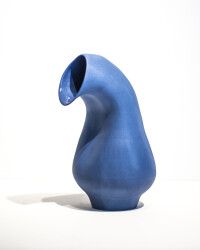 In deep blue, the elegant organic curves of this ceramic vessel by Loren Kaplan appear almost figurative.