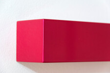 In shiny hot pink, two vertical rectangles sit side by side ‘in sync’ in this elegant wall sculpture by California artist, Lori Cozen-Geller… Image 4