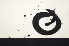 Above a wide strip of black on a white ground floats a rough circle rendered in a single calligraphic brushstroke. Image 3