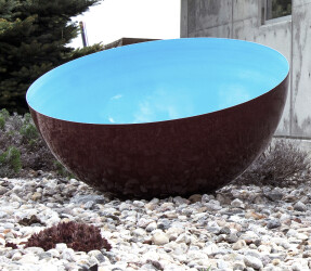 A large stainless steel bowl is coated in a rich cerulean blue by sculptor Marlene Hilton Moore.