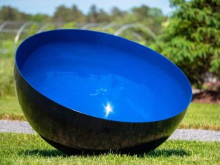 This large, stainless steel bowl is coated in a brilliant ultramarine blue aerospace paint by sculptor Marlene Hilton Moore.