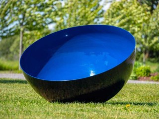 A medium sized stainless steel bowl is coated in a brilliant ultramarine blue by sculptor Marlene Hilton Moore.