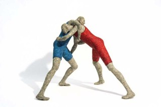 Two figures wrestle in this playful paper mache sculpture by Paul Duval.