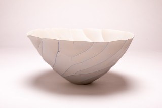 Delicate wave-like patterns swirl around this gorgeous vessel by Paula Murray.