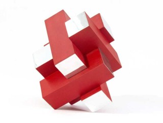 Intersecting geometry in poppy red and polished aluminum form a dynamic whole in this modern sculpture by Philippe Pallafray.