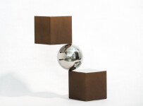 A polished aluminum sphere sits artfully balanced between two rust-coloured and silver cubes in this dynamic modern tabletop sculpture by Ph… Image 3