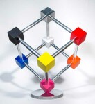 In this dynamic sculpture by Phillipe Pallafray, an open 3D stainless steel cube; each point connected by a brightly coloured solid cube in … Image 5