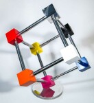 In this dynamic sculpture by Phillipe Pallafray, an open 3D stainless steel cube; each point connected by a brightly coloured solid cube in … Image 8