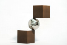 A polished aluminum sphere sits artfully balanced between two rust-coloured and silver cubes in this dynamic modern tabletop sculpture by Ph… Image 2