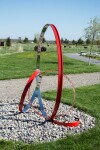 This elegant contemporary outdoor sculpture in bright poppy red was hand-forged from stainless steel by Philippe Pallafray. Image 3