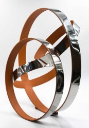 The bright orange interior of these stainless-steel rings by Phillipe Pallafray provides a stunning contrast to the highly polished reflecti…