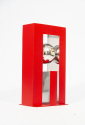 A highly polished stainless-steel ball framed by a rectangular cardinal red form appears to float in this dynamic table-top sculpture by Phi…