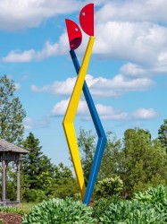 Two abstracted figures in painted steel dance in this playful outdoor sculpture by R.