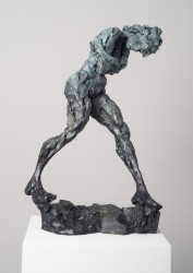 A green patina, male figure sculptured out of bronze.