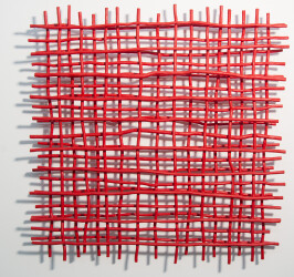 A layered grid of intersecting lengths of bent aluminum is painted in an eye-popping primary red by Shayne Dark.