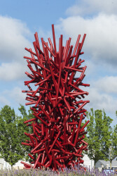 This imposing, rich red metal sculpture by Canadian artist, Shayne Dark is part of the ‘Entangled Series’ he has worked on for years.