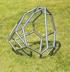 This minimalist outdoor sculpture in stainless steel was conceived by Shayne Dark as a contemporary reference to glacial erratics.