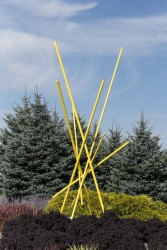 In this dynamic outdoor sculpture by Canadian artist, Shayne Dark, steel rods criss-cross each other, coated in an eye-catching sunny yellow…