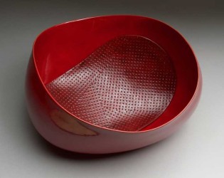 This stunning oval-shaped bowl in a rich red by master ceramicist Steven Heinemann is one of a new series.