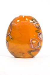 This brilliant orange flattened vessel in blown glass takes its organic shape and wild patterns from nature.