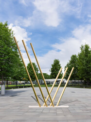 Solid steel rods coated in brilliant brass appear to rise out of the earth and reach for the sky in this dramatic sculpture by Canadian arti…