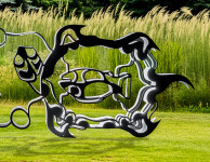 This outdoor metal sculpture of two turtles, inspired by an indigenous artist, lights up at night. Image 3
