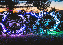 This outdoor metal sculpture of two turtles, inspired by an indigenous artist, lights up at night. Image 5