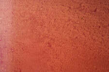 A brushed square of burnt orange rimmed in berry red moves out from the centre of this four-foot square acrylic canvas saturated with layers… Image 4