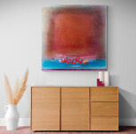 A brushed square of burnt orange rimmed in berry red moves out from the centre of this four-foot square acrylic canvas saturated with layers… Image 6
