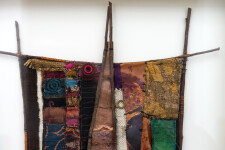 This mixed media contemporary assemblage resembles a vessel and is designed to be hung on a wall. Image 3