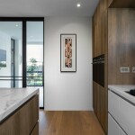 This mixed media contemporary assemblage resembles a vessel and is designed to be hung on a wall. Image 7