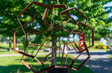 This monumental metal outdoor sculpture is rendered in a contemporary geometric form. Image 5