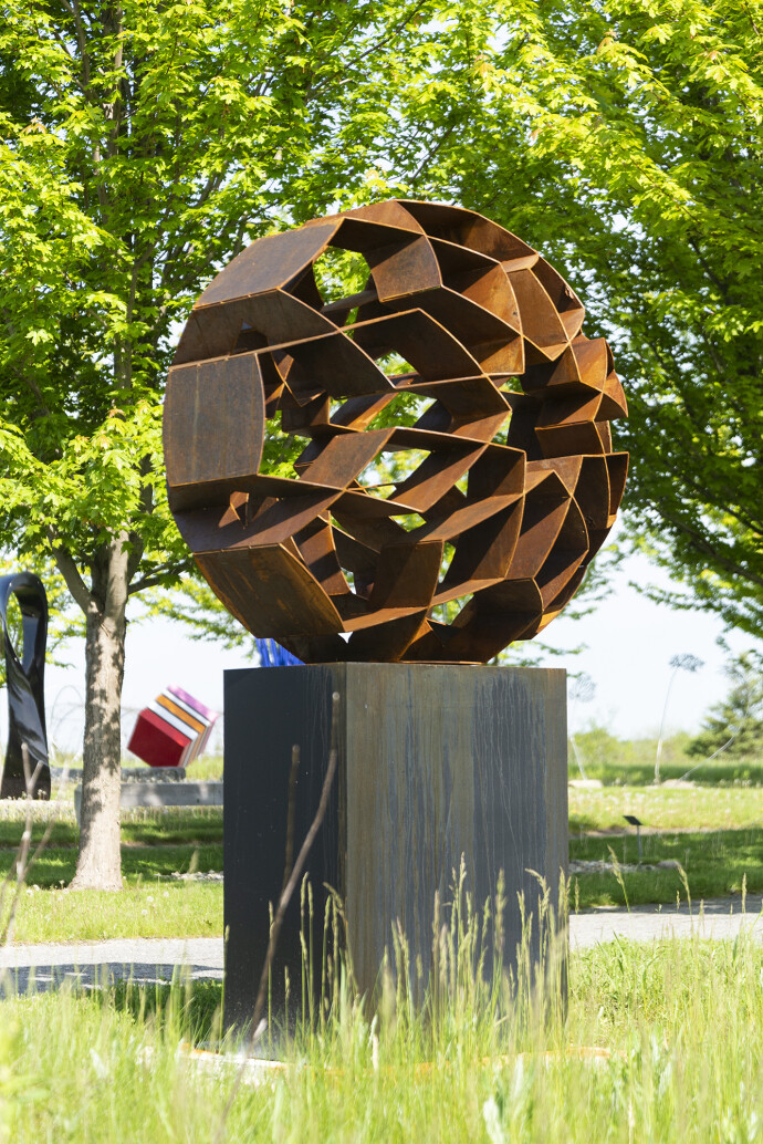 This monumental outdoor sculpture is rendered in a contemporary geometric form.