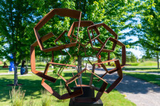 This monumental metal outdoor sculpture is rendered in a contemporary geometric form. Image 7