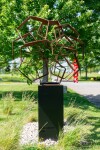 This monumental metal outdoor sculpture is rendered in a contemporary geometric form. Image 4