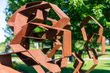This monumental metal outdoor sculpture is rendered in a contemporary geometric form. Image 9