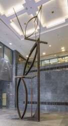 A high modern abstract, monumentally-scaled sculpture by sculptor, André Fauteux, in welded steel and brass.