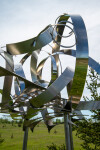 This contemporary outdoor sculpture is forged from stainless steel to resemble clouds. Image 6