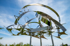 This contemporary outdoor sculpture is forged from stainless steel to resemble clouds. Image 4