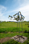 This contemporary outdoor sculpture is forged from stainless steel to resemble clouds. Image 8