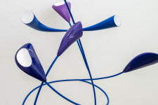 This abstract pop art table top wooden sculpture depicts flowers. Image 3