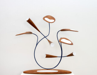 This abstract pop art table top sculpture depicts flowers.