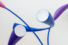 This abstract pop art table top wooden sculpture depicts flowers. Image 8