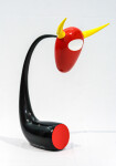 The distinctive shape of a bull’s head attached to a horn-like stand pops in glossy bright colours of red, yellow and black in this whimsica… Image 2