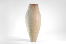 This unique tall ceramic vessel is handmade. Image 2
