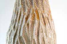 This unique tall ceramic vessel is handmade. Image 8