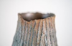 This contemporary tall ceramic vessel is handmade. Image 10