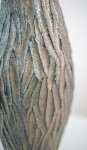 This contemporary tall ceramic vessel is handmade. Image 9