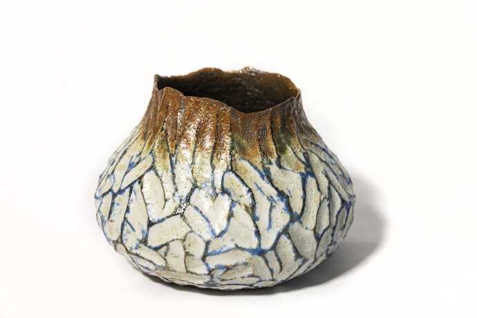 This contemporary ceramic vessel is hand-built.